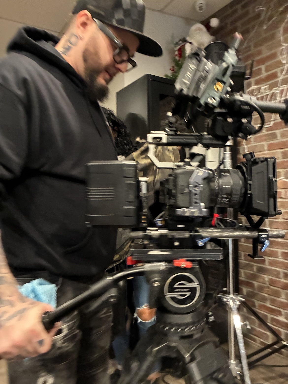 A cameraman filming behind the scenes